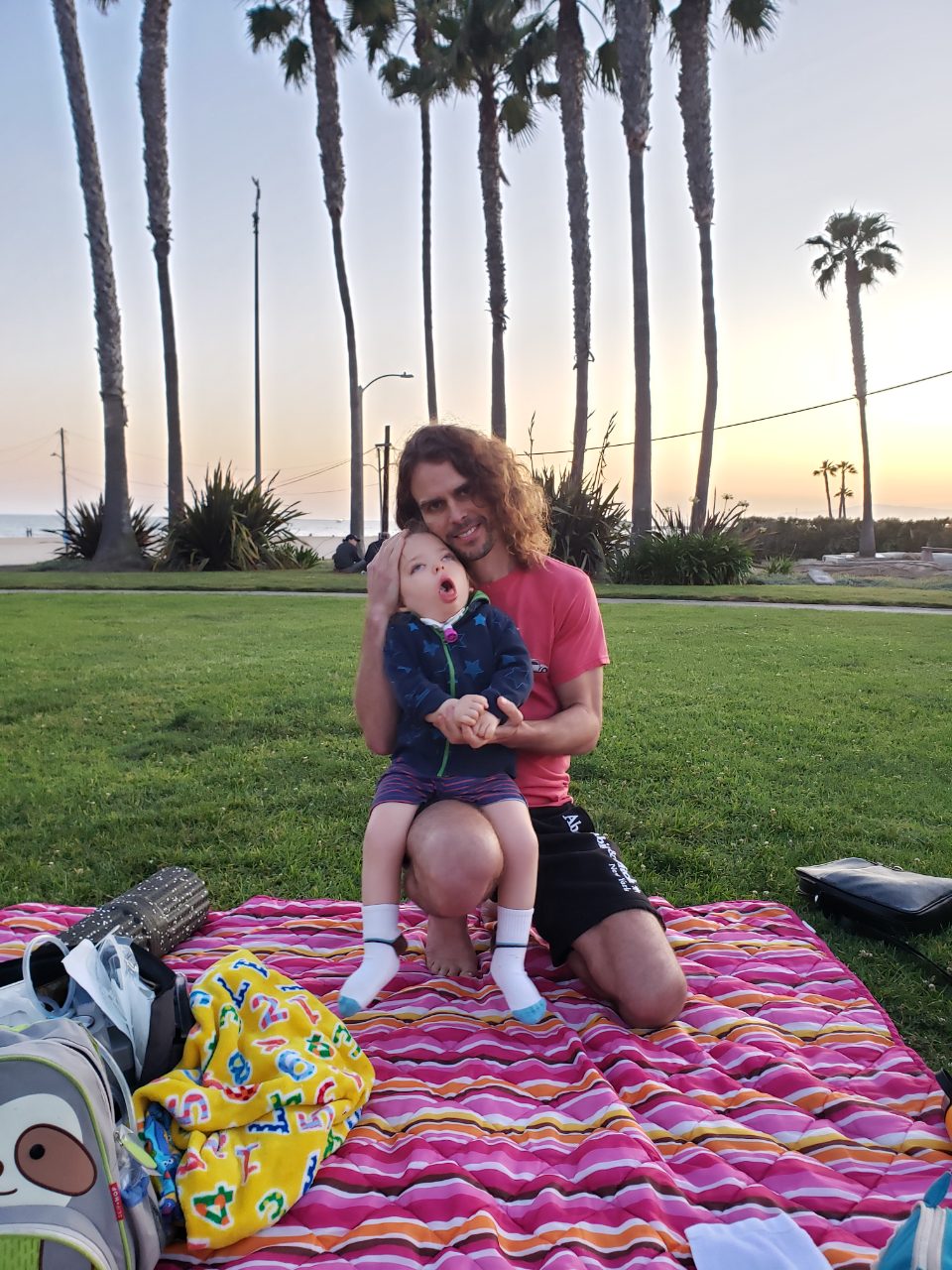 James holding River at the beach park