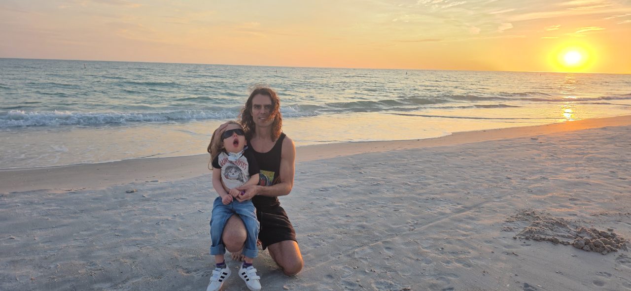 James and River at the beach at sunset
